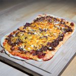 Crispy homemade pizza with bubbling cheese and fresh toppings, baked on easy pizza dough