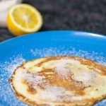delicious pancakes in a plat with sugar and cinnamon on