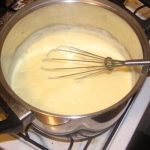white sauce in a pot perfect for mac and cheese